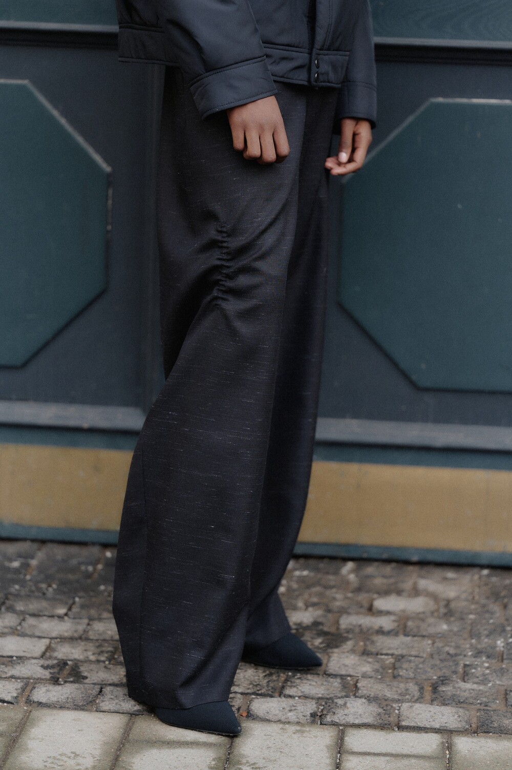 Black trousers with pintucks